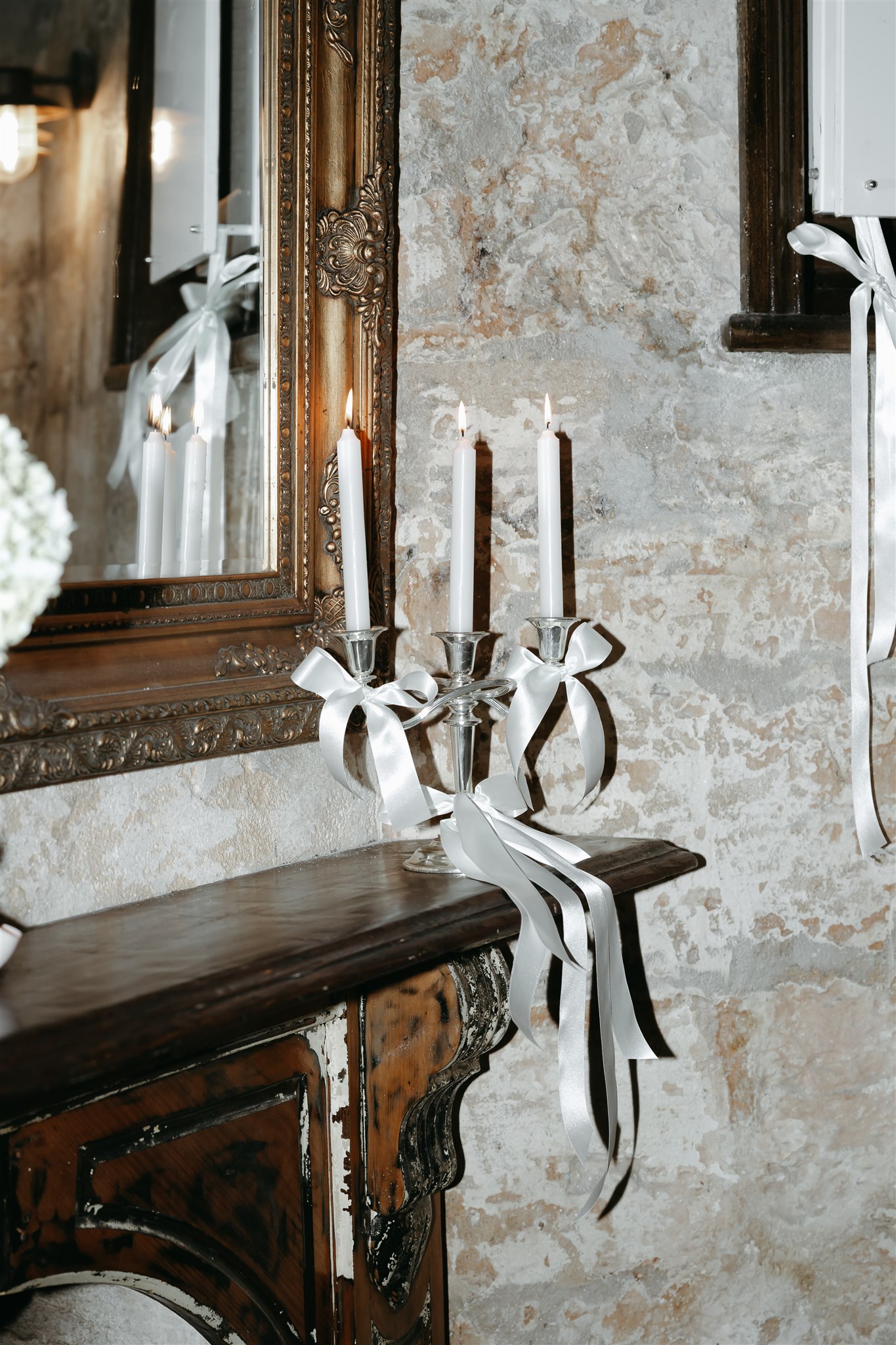 Unique wedding styling featuring bows, candles and premium linen signage