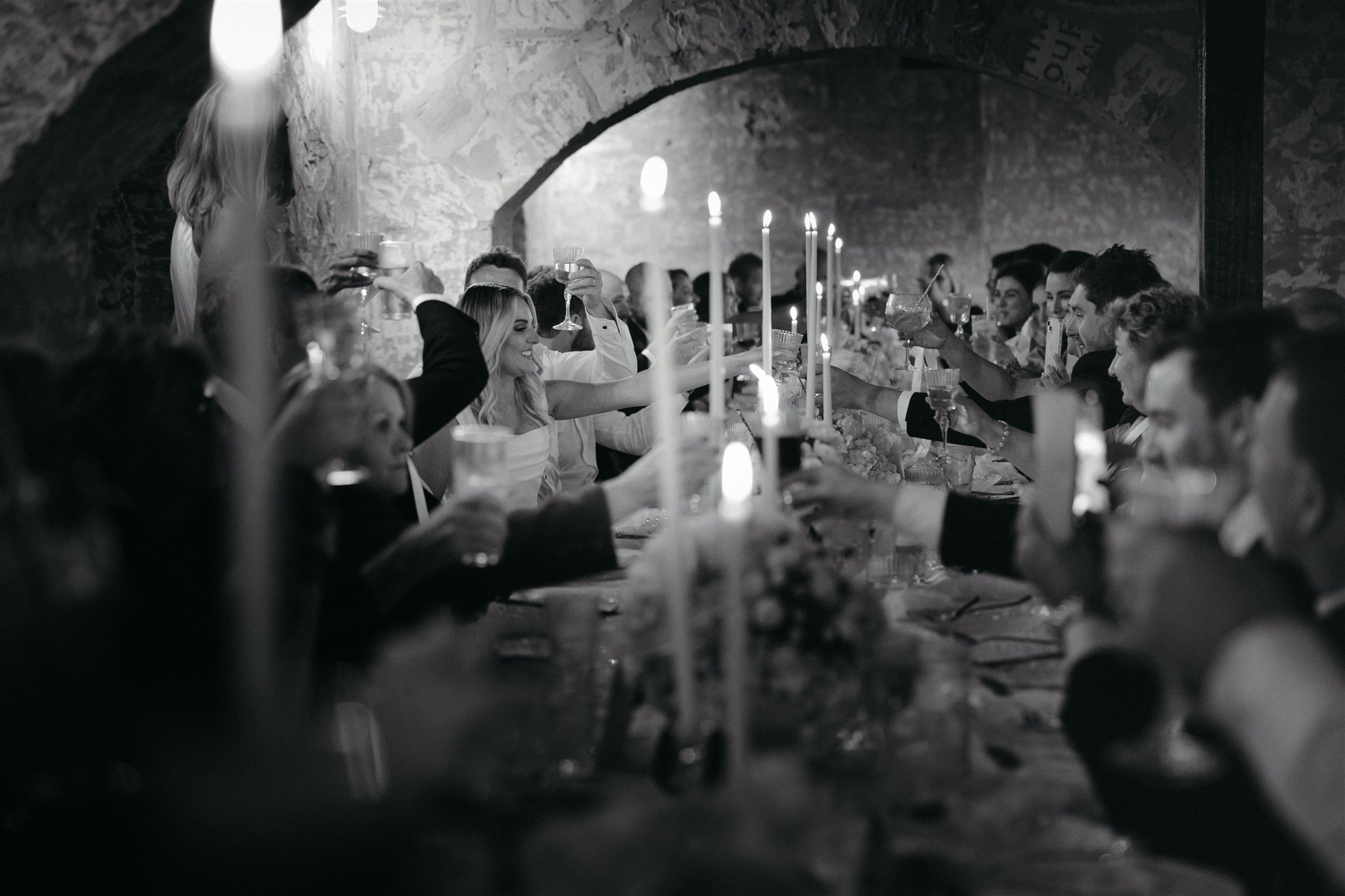 Elegant wedding styling with pearl-themed accents, premium linens, and vintage tableware at Lauren and Bernie’s romantic intimate wedding reception at Frolic Lane. Showcasing unique sandstone arches in the background. 35mm film wedding photography.