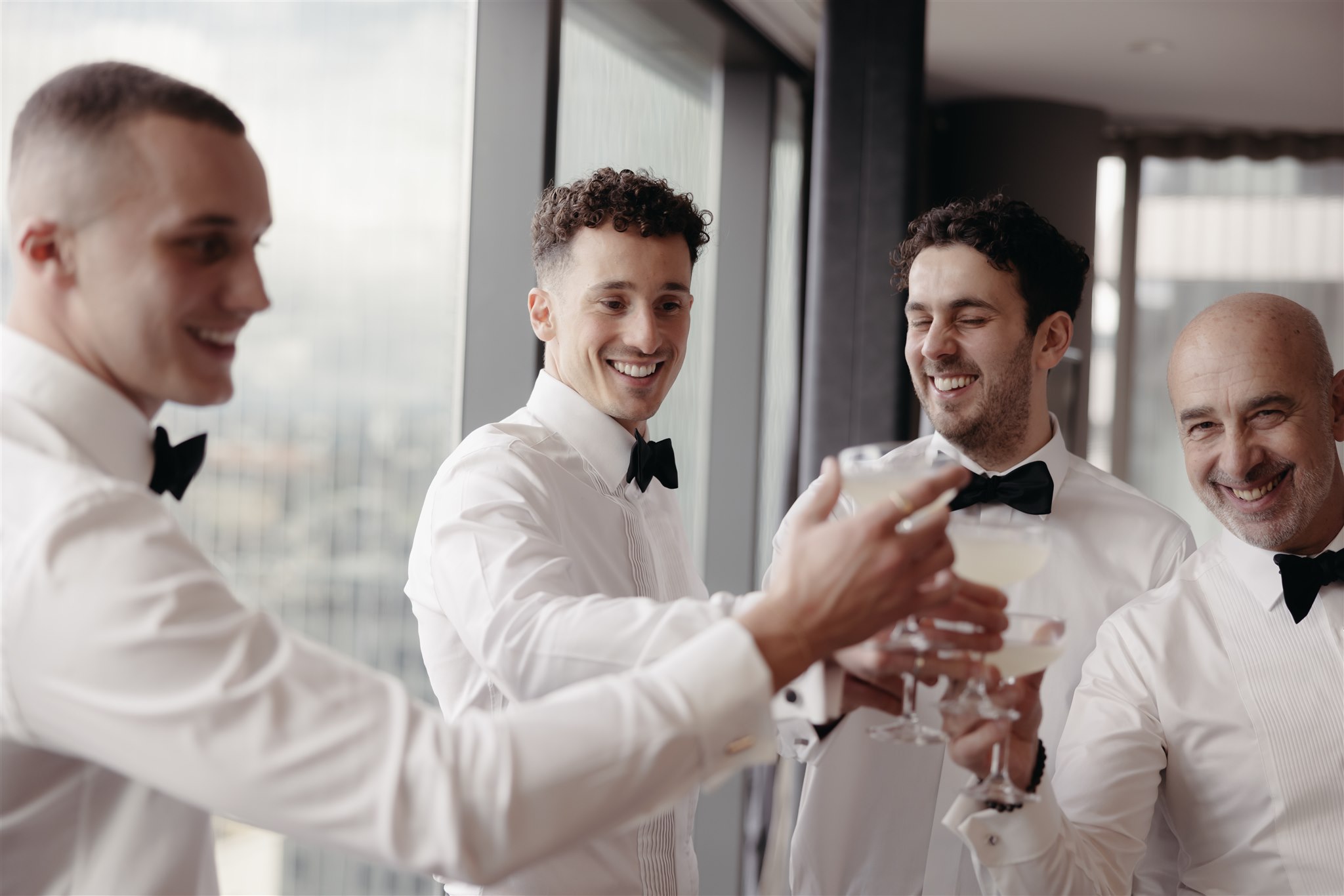 Groom and Groomsmen getting ready photos by Luxury Wedding Photographer Maegan Brown