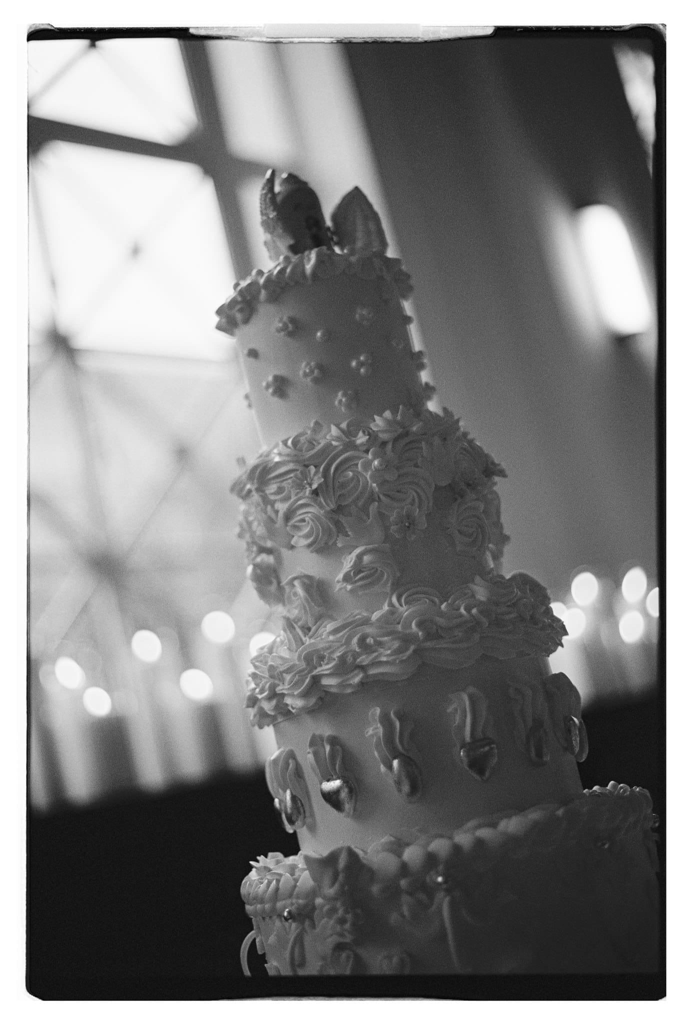 The Del Moro’s Wedding Styling Photography Black and white wedding cake captured in 35mm film